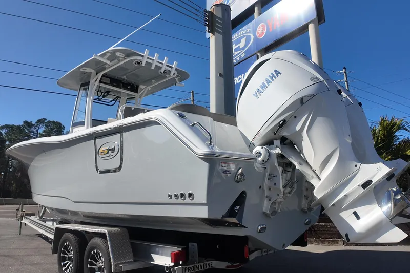 Slide: The Image of 2025 Sea Hunt Ultra 275 SE boat with Yamaha engine on trailer. - 1