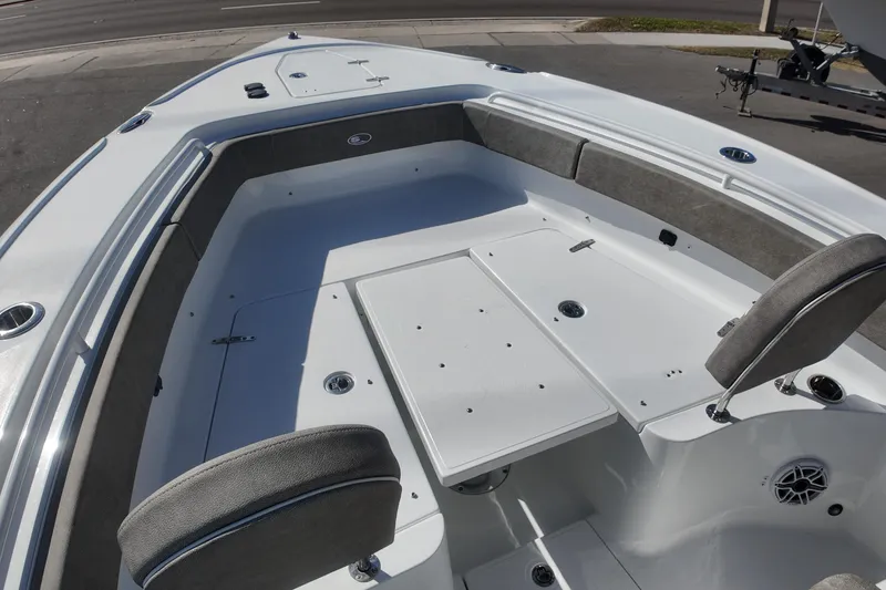 Slide: The Image of 2025 Sea Hunt Ultra 275 SE boat interior with seating and table. - 10