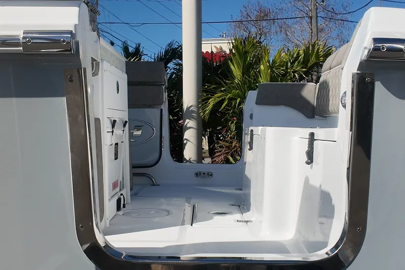 Slide: The Image of 2025 Sea Hunt Ultra 275 SE boat interior with seating and storage compartments. - 19