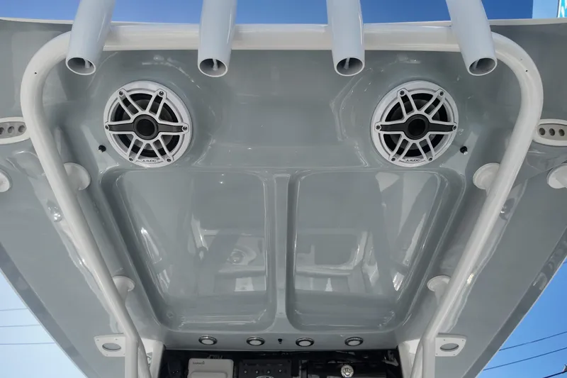 Slide: The Image of 2025 Sea Hunt Ultra 275 SE boat speakers and rod holders on T-top. - 20