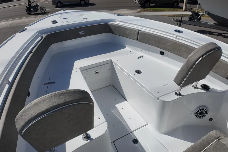 Slide: The Image of 2025 Sea Hunt Ultra 275 SE boat interior with cushioned seating and storage compartments. - 9
