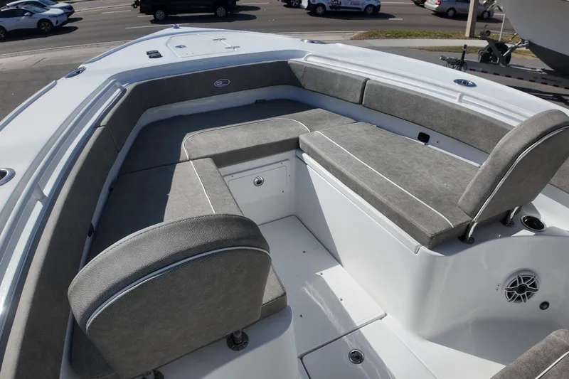 Slide: The Image of 2025 Sea Hunt Ultra 275 SE boat interior with gray cushioned seating. - 8