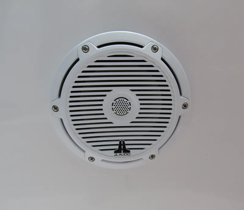 Slide: The Image of White JL Audio speaker on 2024 Axopar 37 Sun Top boat. - 36