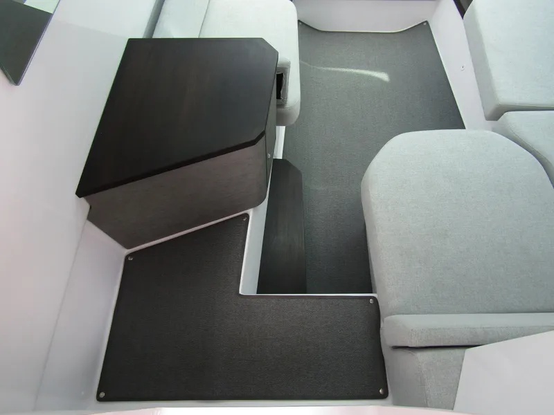 Slide: The Image of 2024 Axopar 37 Sun Top interior with modern seating and sleek design. - 21