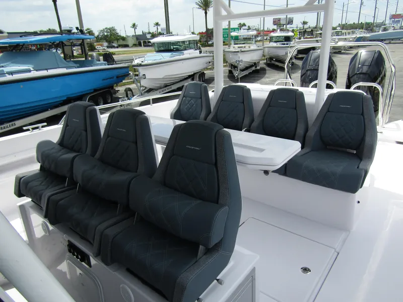 Slide: The Image of 2024 Axopar 37 Sun Top boat with luxurious seating and sleek design. - 13