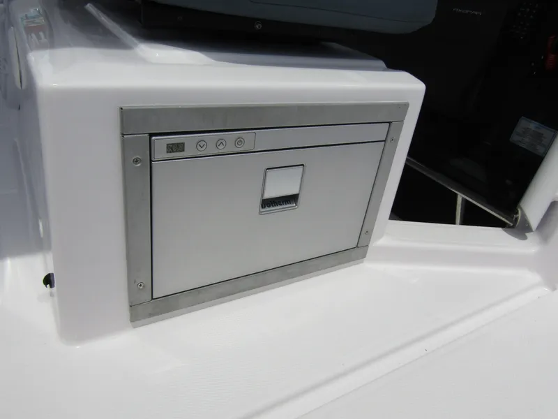 Slide: The Image of 2024 Axopar 37 Sun Top boat, featuring a sleek built-in storage compartment. - 18