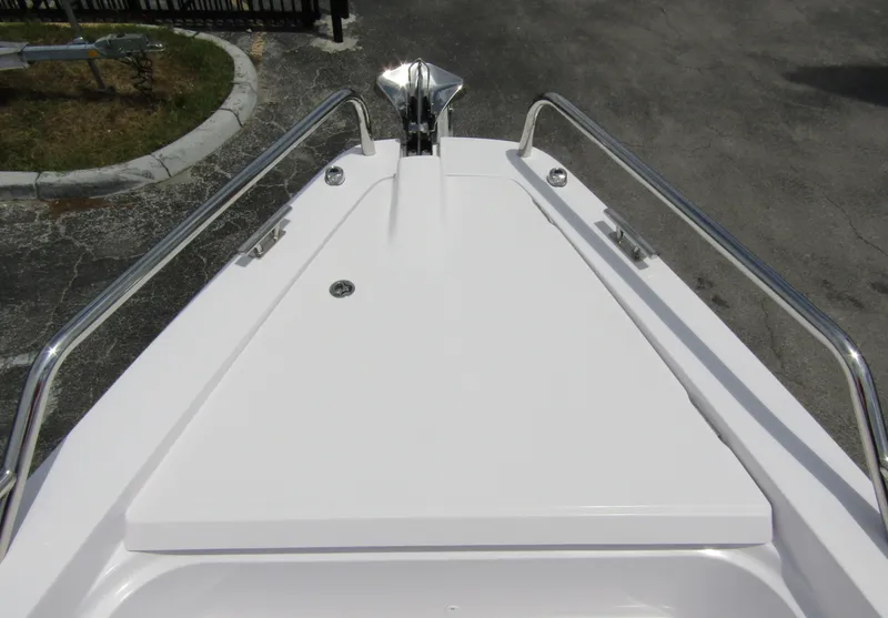 Slide: The Image of 2024 Axopar 37 Sun Top boat deck with stainless steel railings. - 9