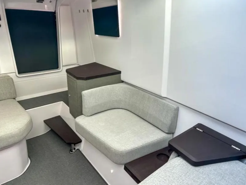 Slide: The Image of Interior of 2024 Axopar 37 Sun Top, featuring modern seating and sleek design. - 15