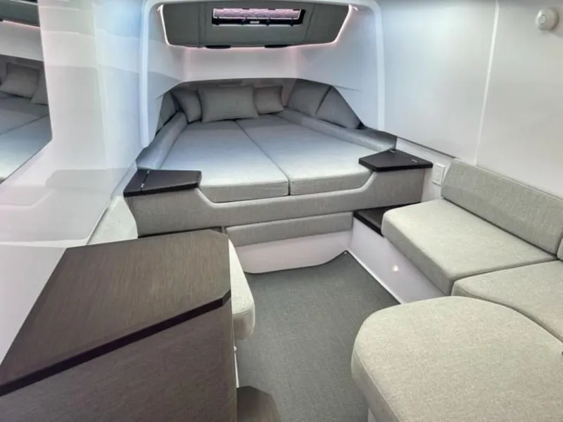 Slide: The Image of Luxurious interior cabin of the 2024 Axopar 37 Sun Top with modern grey upholstery. - 11