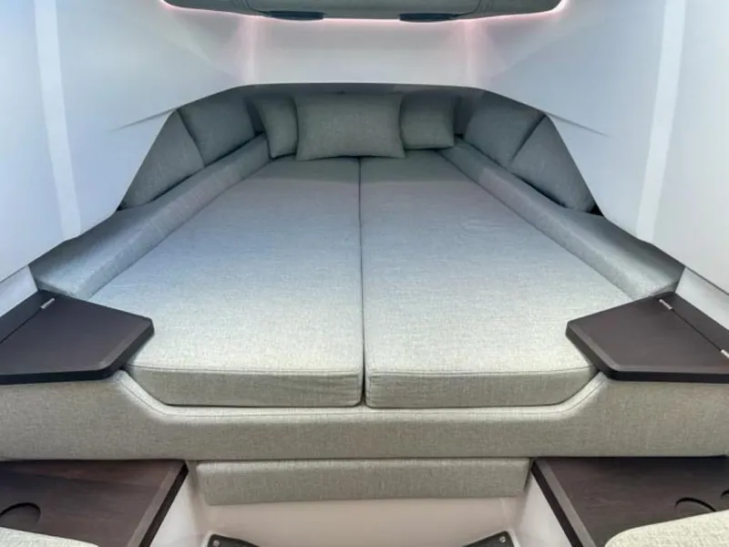 Slide: The Image of 2024 Axopar 37 Sun Top cabin interior with spacious bed and modern design. - 12