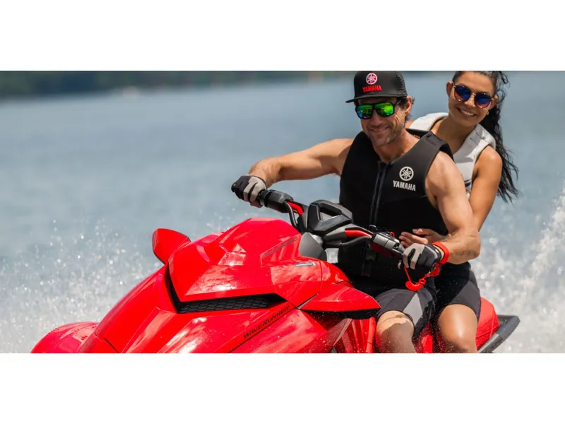Slide: The Image of Two people riding 2026 Yamaha GP SVHO jet ski on water. - 14