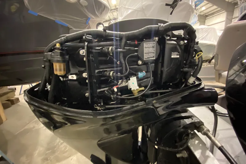 Slide: The Image of 2021 Lund SSV-18 boat engine close-up in a workshop setting. - 14