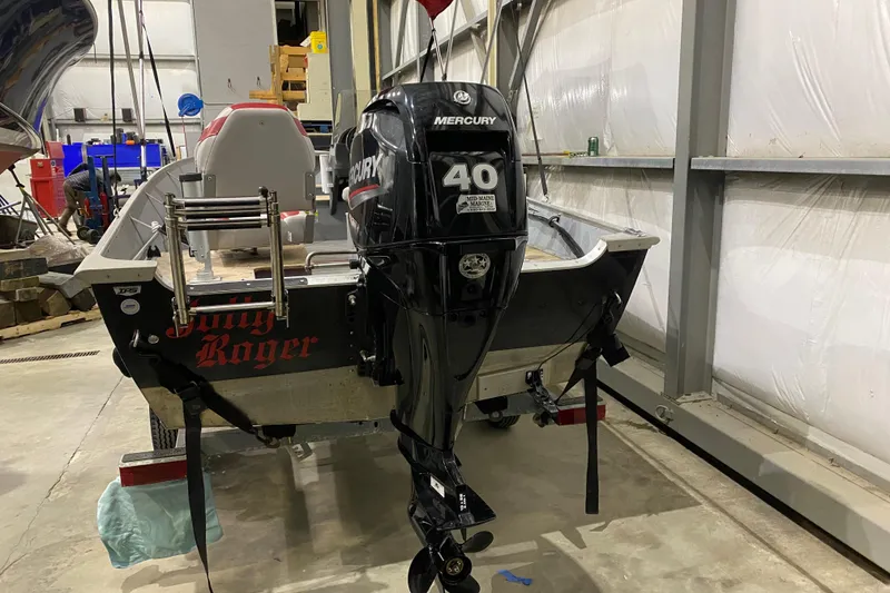 Slide: The Image of 2021 Lund SSV-18 boat with Mercury 40 HP outboard motor in a garage. - 5