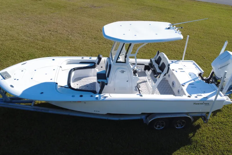 Slide: The Image of 2024 Tidewater 2500 Carolina Bay boat on grassy field, aerial view. - 11