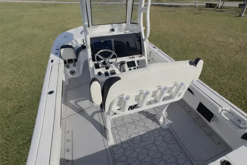 Slide: The Image of 2024 Tidewater 2500 Carolina Bay boat interior with modern helm and seating. - 21
