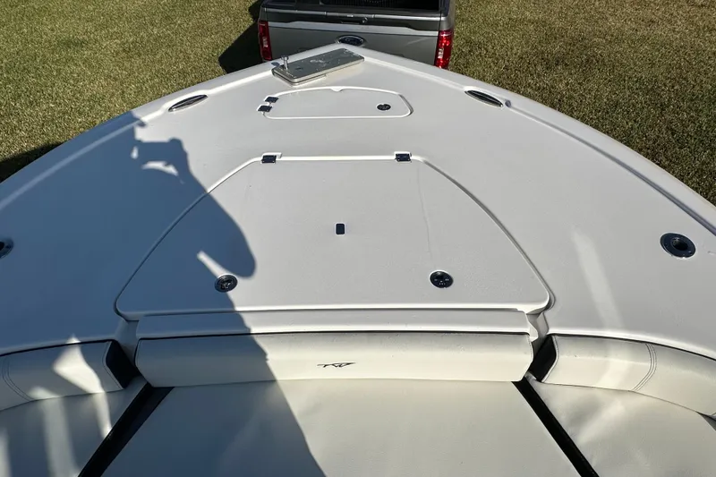 Slide: The Image of 2024 Tidewater 2500 Carolina Bay boat deck with storage compartments and seating. - 32
