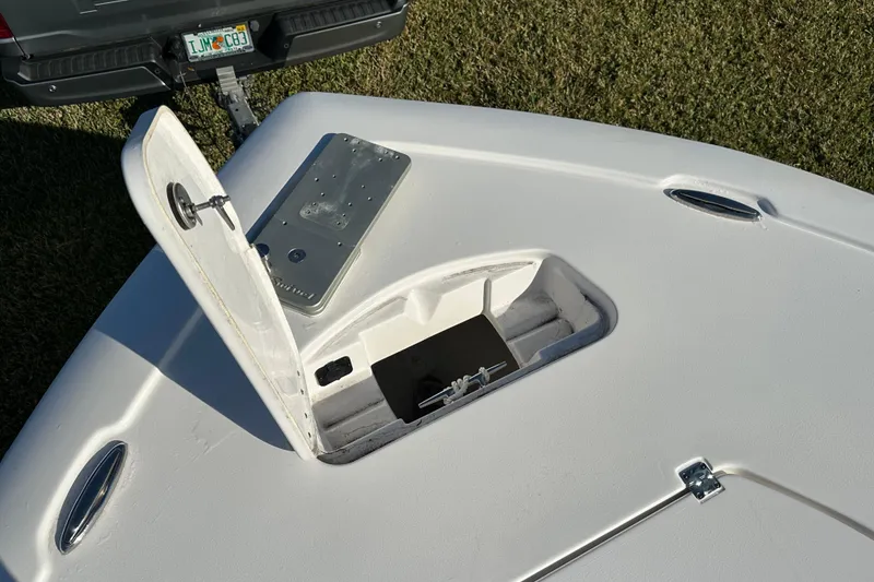 Slide: The Image of 2024 Tidewater 2500 Carolina Bay boat with open storage compartment, viewed from above. - 35