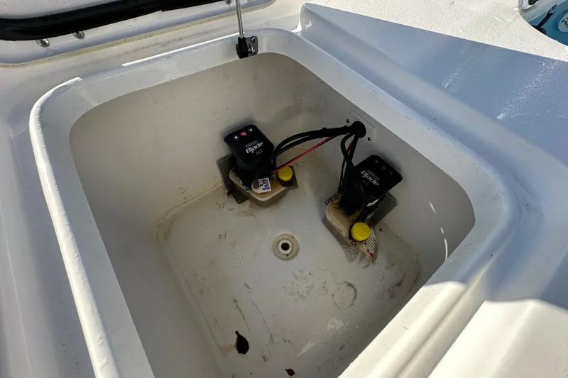Slide: The Image of 2024 Tidewater 2500 Carolina Bay boat compartment with wiring and components. - 48