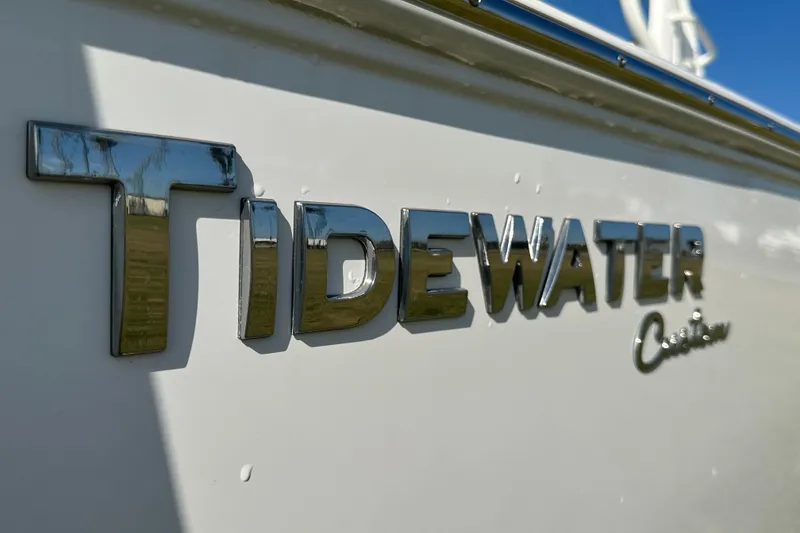 Slide: The Image of 2024 Tidewater 2500 Carolina Bay boat logo in shiny chrome lettering. - 51