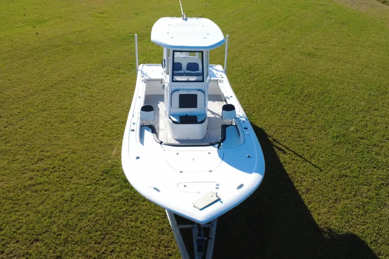 Slide: The Image of 2024 Tidewater 2500 Carolina Bay boat on trailer under sunny sky. - 9