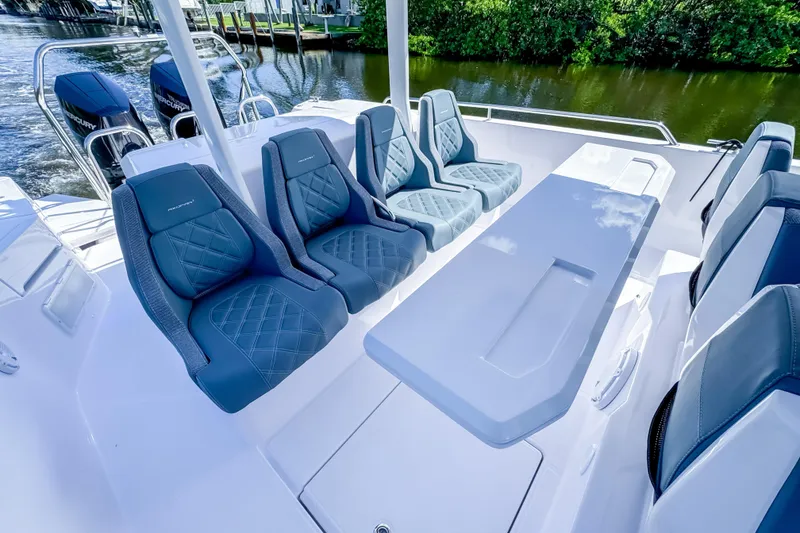 Slide: The Image of 2024 Axopar 37 Sun Top boat interior with luxurious seating and sleek design. - 16