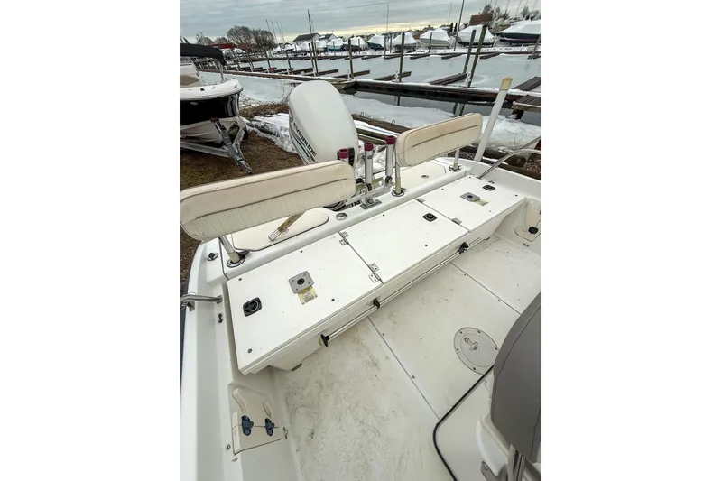 Slide: The Image of 1999 Boston Whaler 18 Dauntless boat interior with seating and storage compartments. - 12