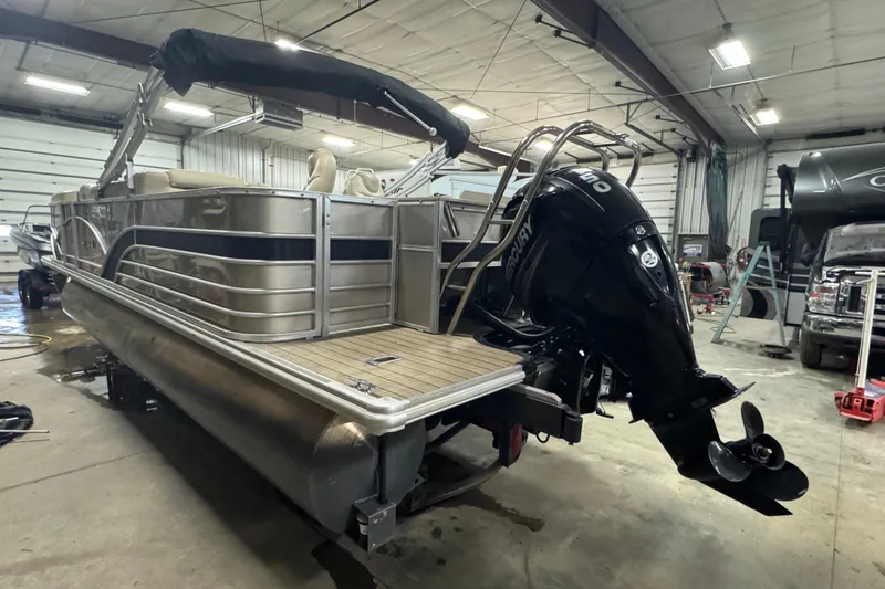 Slide: The Image of 2018 Sylvan Mirage Fish 8522 Party Fish pontoon boat in a garage setting. - 5