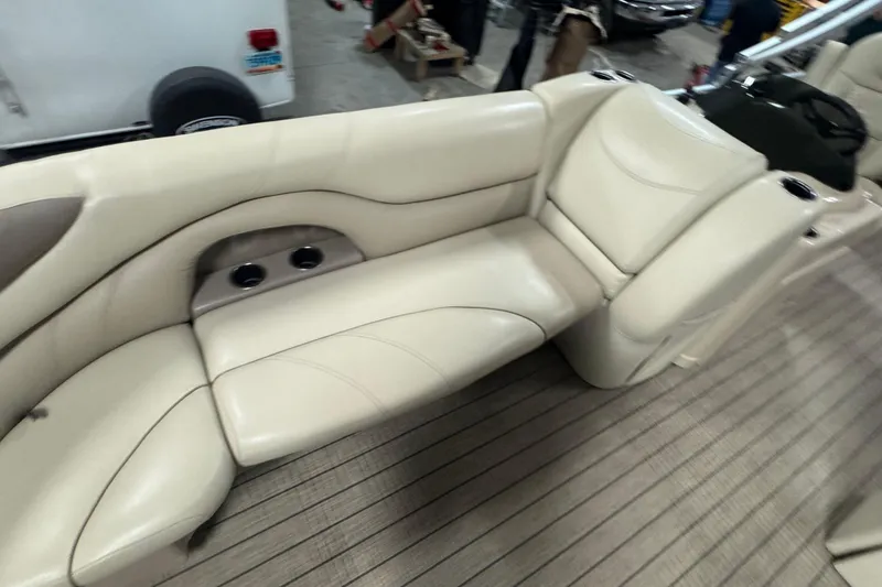 Slide: The Image of 2018 Sylvan Mirage Fish 8522 Party Fish boat with beige seating and cup holders. - 8