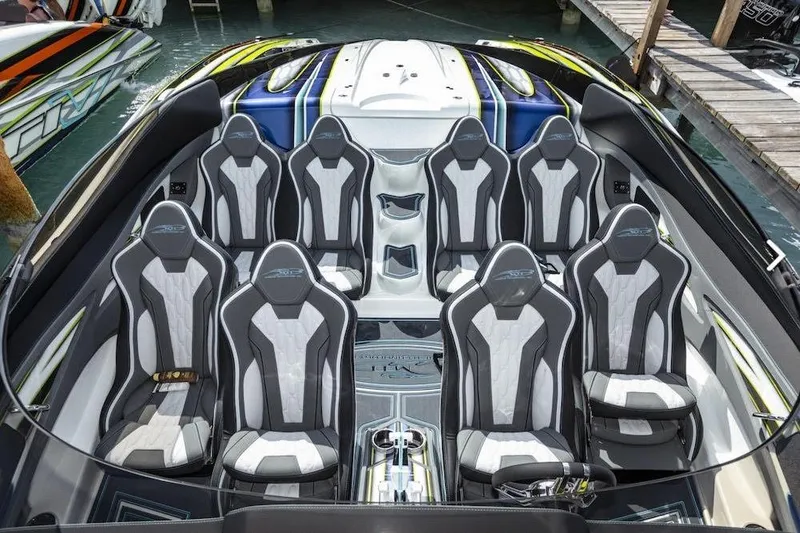Slide: The Image of Luxury MTI 48 boat interior with eight sleek, modern seats, docked by the water. - 3