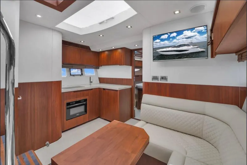 Slide: The Image of Luxurious interior of 2017 Galeon 445 HTS yacht with modern kitchen and seating area. - 12