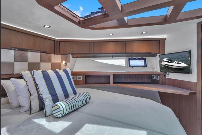 Slide: The Image of Luxurious interior of 2017 Galeon 445 HTS yacht with elegant wood finishes and skylight. - 13