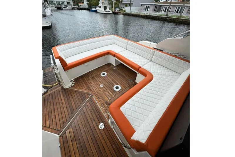 Slide: The Image of Luxurious seating on 2017 Galeon 445 HTS yacht with quilted cushions and wooden deck. - 15