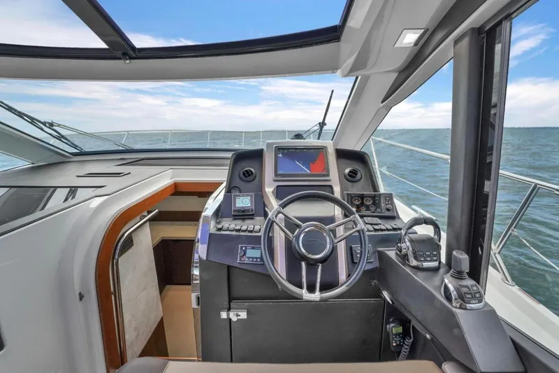 Slide: The Image of Helm of 2017 Galeon 445 HTS yacht with modern navigation equipment. - 16