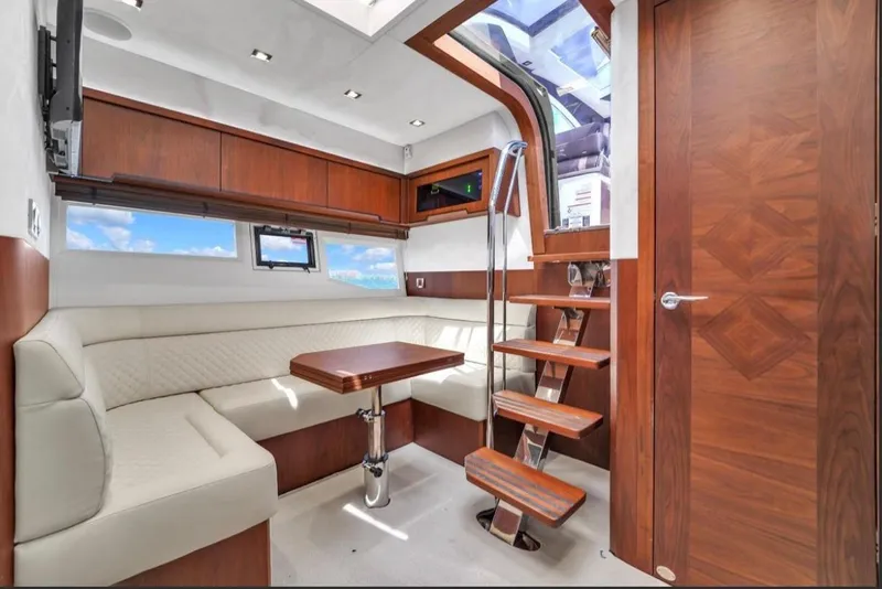 Slide: The Image of Luxurious interior of 2017 Galeon 445 HTS yacht with elegant wood finishes and seating. - 17