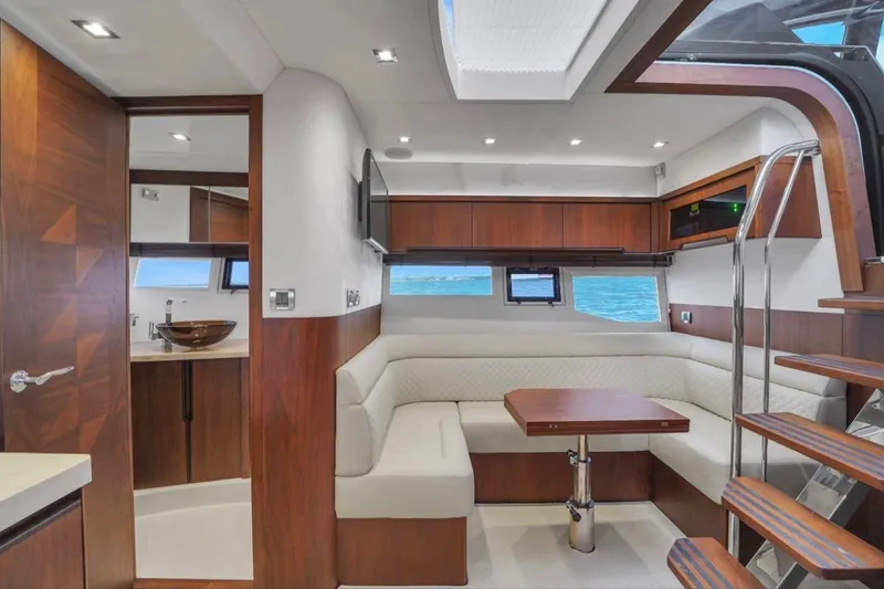 Slide: The Image of Luxurious interior of 2017 Galeon 445 HTS yacht with modern seating and wooden accents. - 22