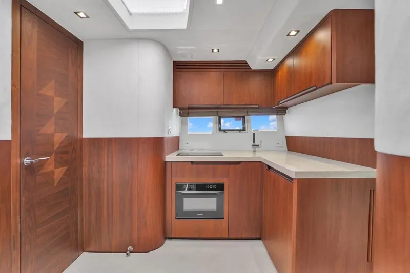 Slide: The Image of Luxurious kitchen interior of 2017 Galeon 445 HTS yacht with modern wood cabinetry. - 25