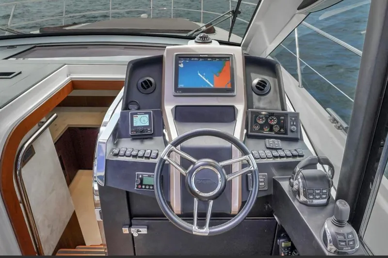 Slide: The Image of Cockpit of 2017 Galeon 445 HTS yacht with navigation controls and steering wheel. - 27