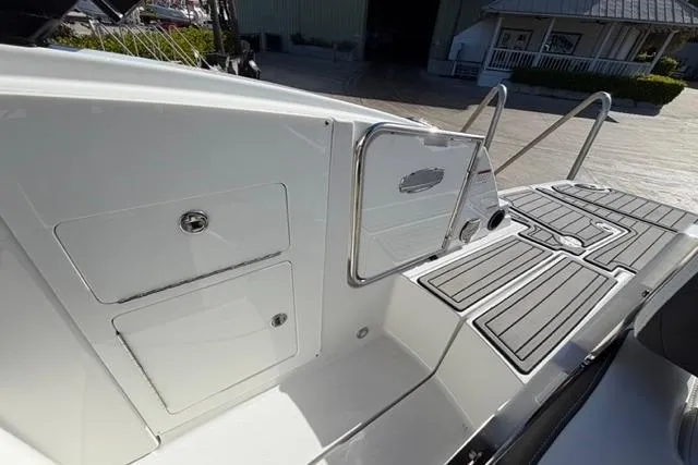 Slide: The Image of 2021 Monterey M-65 boat deck with sleek design and storage compartments. - 13