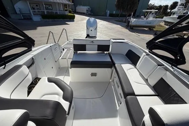 Slide: The Image of Luxurious 2021 Monterey M-65 boat interior with sleek black and white seating. - 16