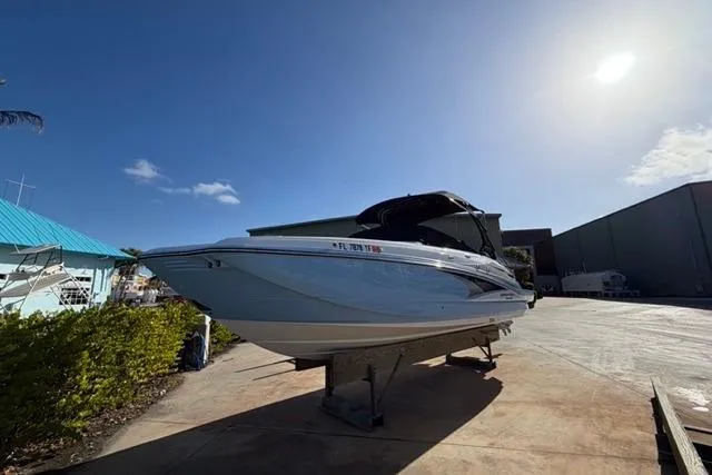 Slide: The Image of 2021 Monterey M-65 boat on dry dock under clear blue sky. - 17