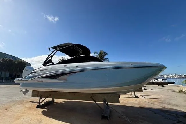 Slide: The Image of 2021 Monterey M-65 boat on display, sleek design, blue sky background. - 18