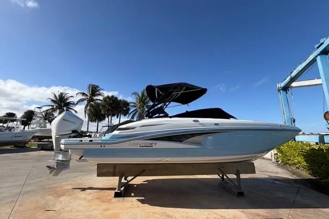 Slide: The Image of 2021 Monterey M-65 boat on display under clear blue sky. - 19