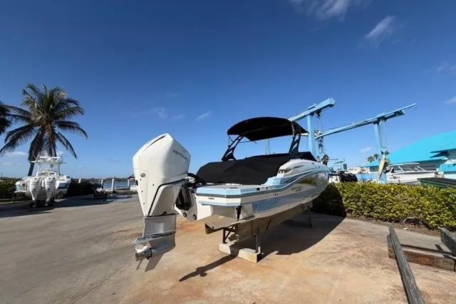 Slide: The Image of 2021 Monterey M-65 boat on dry dock under clear blue sky. - 20