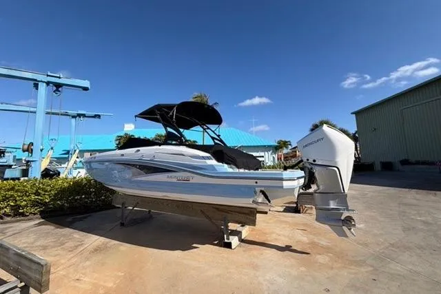 Slide: The Image of 2021 Monterey M-65 boat with outboard motor on a sunny day at a marina. - 22