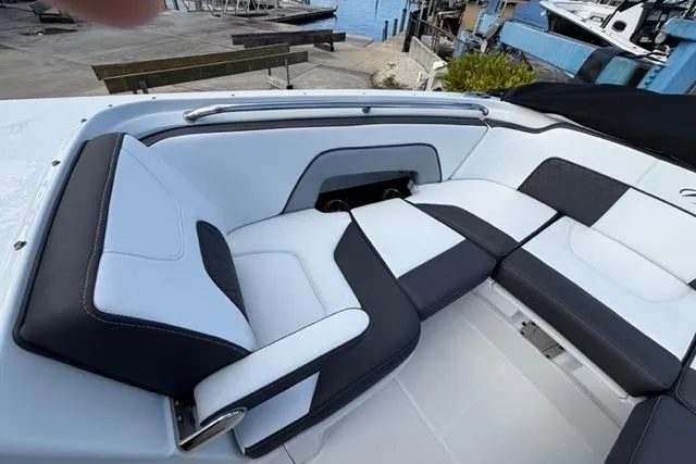 Slide: The Image of Luxurious seating on 2021 Monterey M-65 boat, featuring sleek black and white upholstery. - 4