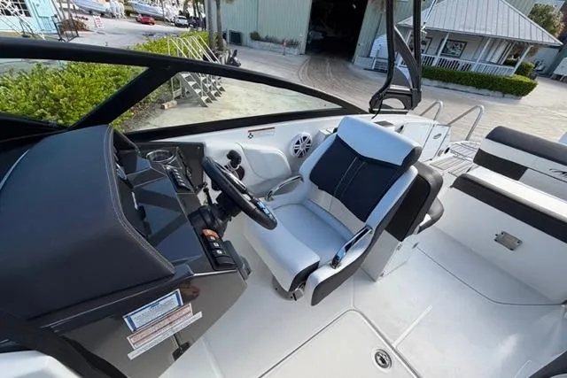 Slide: The Image of 2021 Monterey M-65 boat interior with sleek helm and comfortable seating. - 9