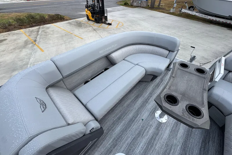 Slide: The Image of 2026 Bennington 24 MFB pontoon boat with gray seating and cup holders on deck. - 20