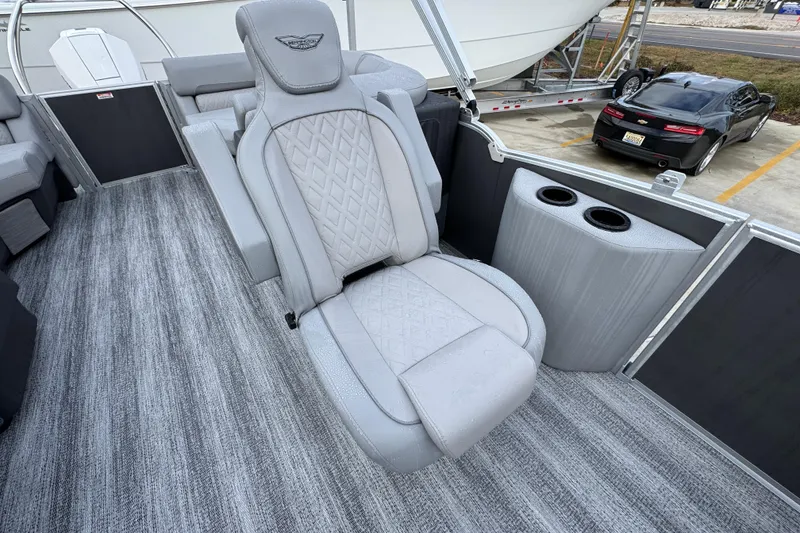 Slide: The Image of Luxurious seating on 2026 Bennington 24 MFB pontoon boat with cup holders and stylish design. - 22