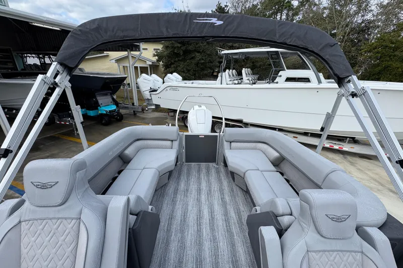Slide: The Image of 2026 Bennington 24 MFB pontoon boat with luxurious gray seating and canopy. - 27