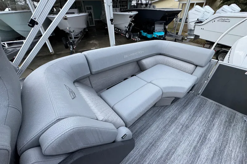 Slide: The Image of 2026 Bennington 24 MFB boat with luxurious gray seating and modern design. - 28